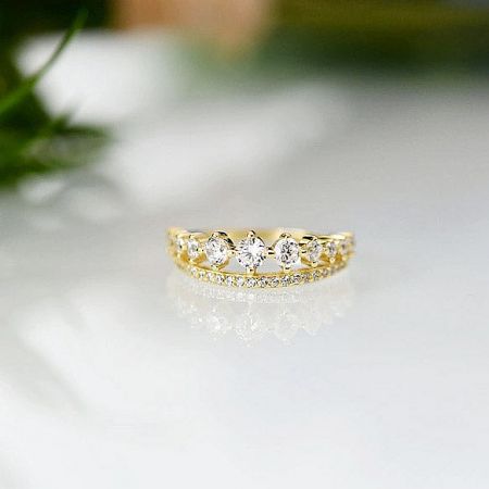 Detailed view of the pavé crystal setting on the gold-plated sterling silver ring.