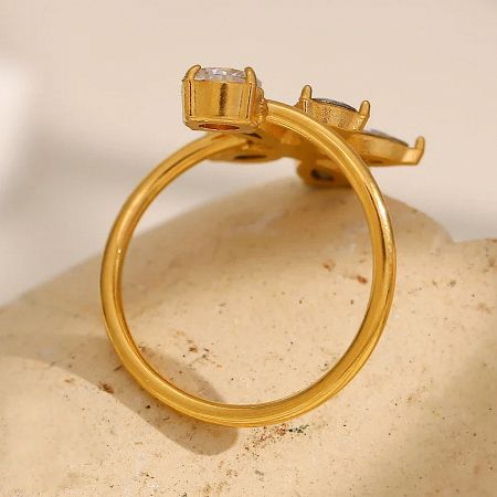 Side view of the open, adjustable band on the gold-plated flower ring.