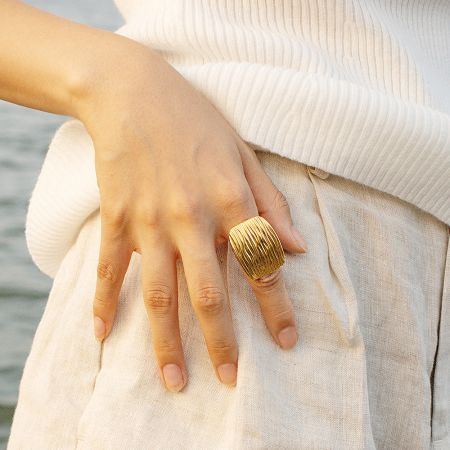 Gold geometric ring with prominent vertical ridges for a bold look.