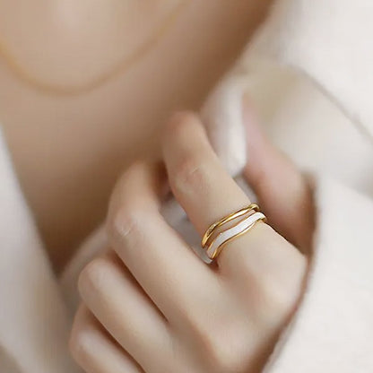Styling suggestion showing the adjustable rings paired with a matching gold necklace.