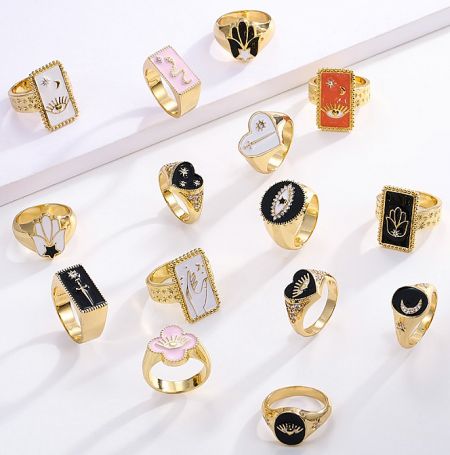 Tarot Card Enamel Ring Collection - A collection of Tarot Card Enamel Rings by JR Fashion Accessories, showcasing various gold-plated designs with celestial and mystical motifs.