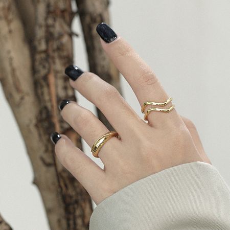 Model wearing the 18K gold-plated wave ring, demonstrating its elegant and minimalist style for everyday wear.