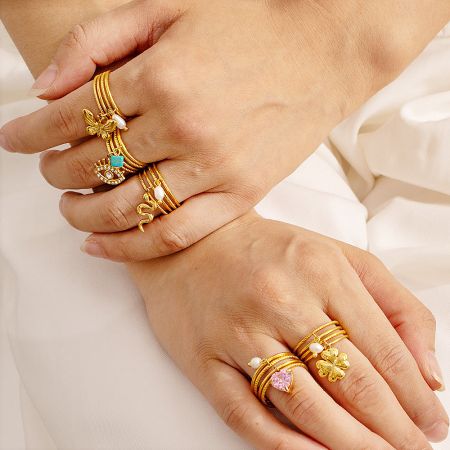 Close-up view of the five themed charm rings, highlighting the detailed craftsmanship.