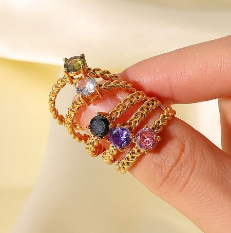 Gold Plated Wholesale Ring - A collection of gold-plated wholesale rings with vibrant colored gemstones by JR Fashion Accessories, model JRR-026.