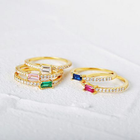 Top-down view of the elegant sterling silver rings with vibrant zircon crystals.