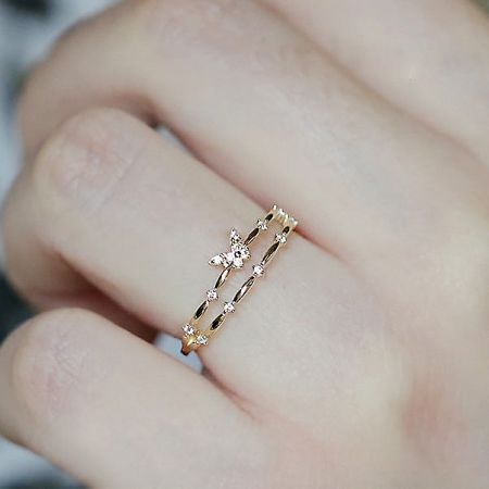 Model wearing the adjustable double-layer butterfly ring, demonstrating its elegant fit.
