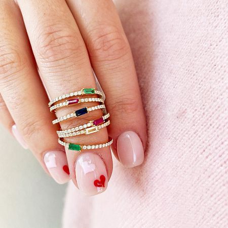 A collection of 925 sterling silver baguette zircon rings in various gemstone colors.