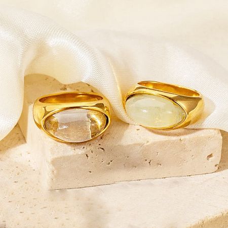 A clear view of the distinct oval-shaped opal stones set in the stainless steel rings.