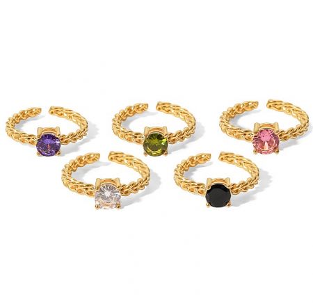 Display of six distinct gold-plated rings featuring various gemstone cuts and colors.