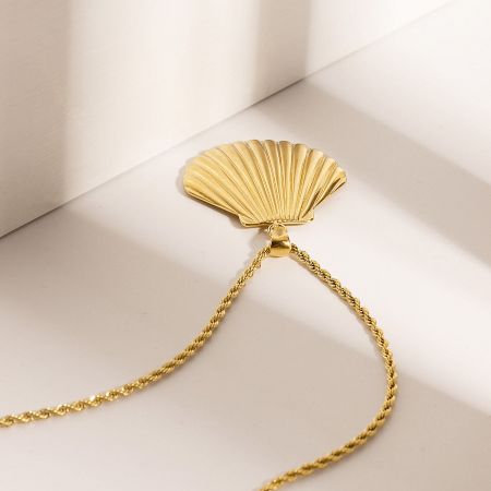 Full view of the stainless steel beach-themed necklace with shell pendant.