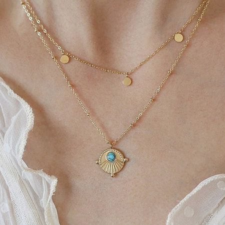 Boho style 925 silver necklace with a turquoise stone pendant.
