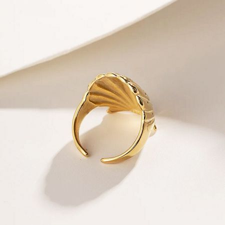 Studio product shot of the open-back gold shell ring.