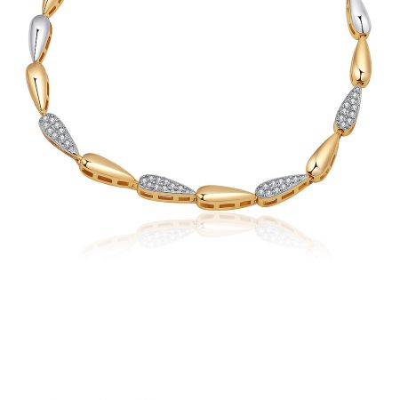 Detailed view of the luxury two-tone bracelet showcasing the intricate link design and sparkling cubic zirconia stones.