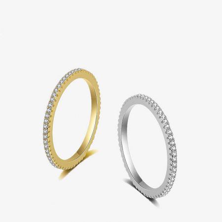 An elegant display of the gold and silver CZ eternity band rings, perfect for wholesale jewelry collections.
