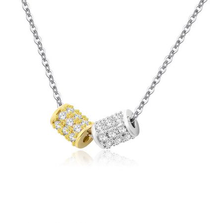 Dual-pendant necklace with gold and silver plating and stone accents.