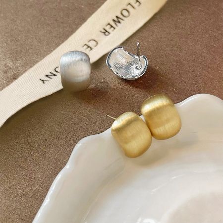 Simple French Metal Bead Design Vintage Brushed Matte Stud Earrings (Set of 5 Pairs) - A set of simple French metal bead stud earrings in gold and silver finishes, displayed on a ceramic dish.
