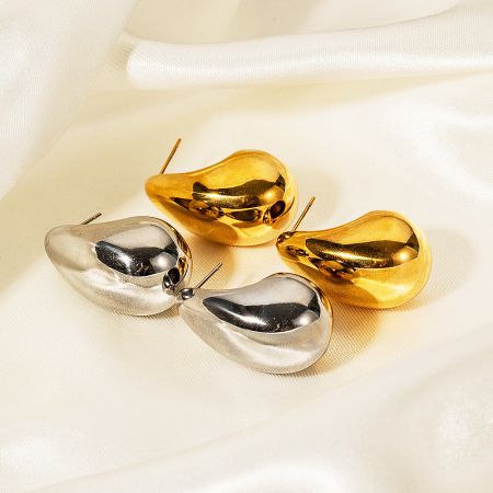 Close-up view of the chubby water drop earrings, highlighting the smooth polished surface in both gold and silver.