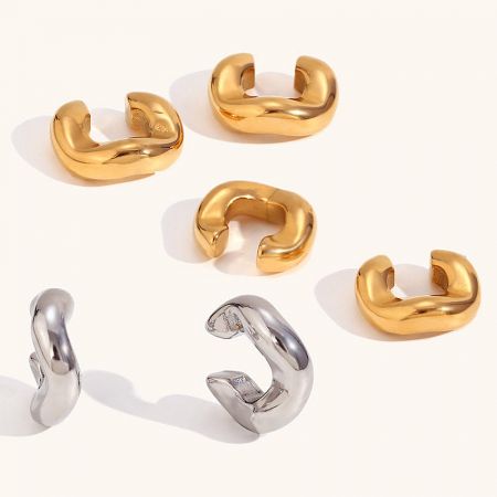 Close-up product photo of six minimalist geometric ear cuffs in gold and silver.
