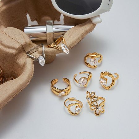 The complete set of five non-tarnish titanium steel rings with zircon accents, displayed together to show their versatile designs.