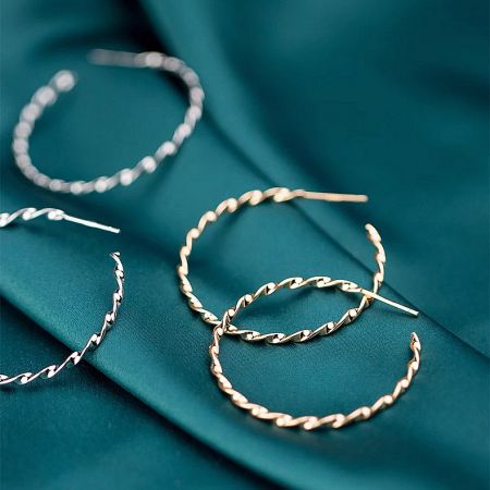 925 Silver Twist Rope C Hoop Earrings (5 pairs) - A collection of 925 sterling silver twist rope C hoop earrings in both gold and silver finishes, elegantly displayed on a textured teal fabric.