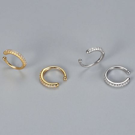A stylish arrangement of gold and silver ear cuffs for versatile wear.