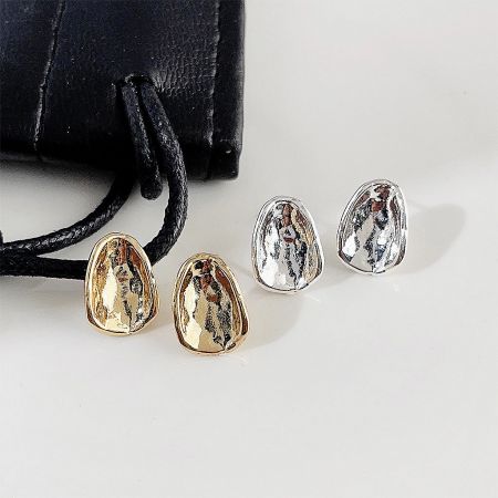 Simple Daily-Wear Oval Button Stud Earrings (Set of 5 Pairs) - A set of simple oval button stud earrings in both gold and silver plating, displayed on a white surface next to a black branded pouch.