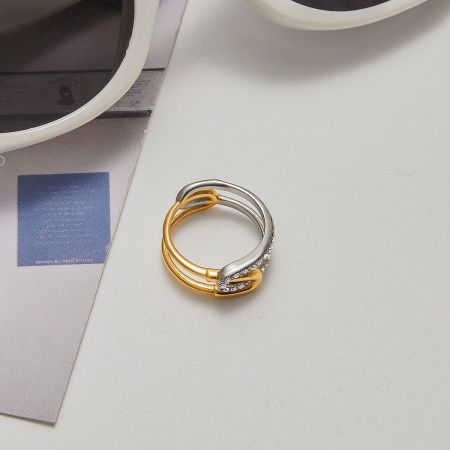 Stylish mixed-metal stainless steel ring with rhinestones, perfect for modern fashion looks.