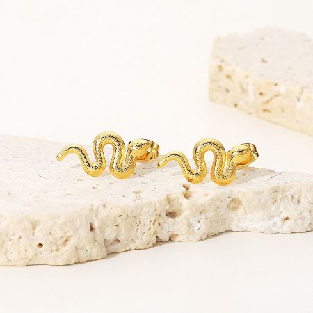 A pair of gold snake-shaped earrings shown together.
