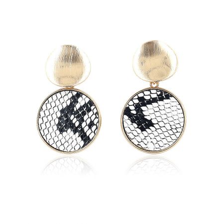 Close-up of the earring showing the brushed gold top and the black and white snakeskin pattern.