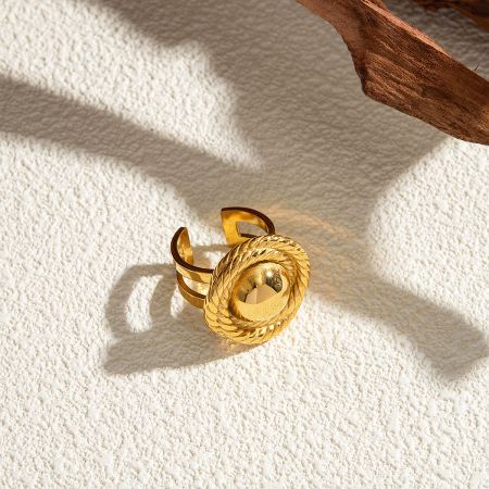 A unique spiral-designed gold-tone open ring from the adjustable set.