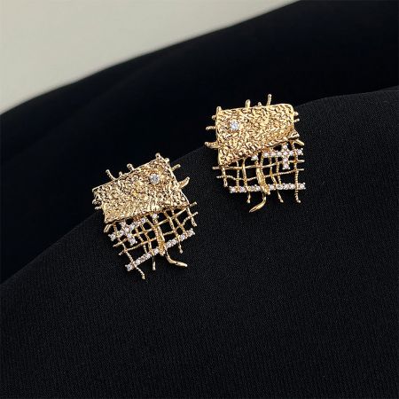 Elegant gold-plated brass geometric statement earrings with sparkling zircon accents.
