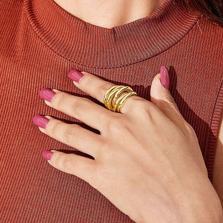 Close-up of the gold vintage multi-layered cuff open ring being worn.