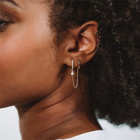 925 Sterling Silver Piercing Star Zircon Chain Hoop Earrings (Set of 5) - Close-up of a gold-tone 925 sterling silver hoop earring featuring a sparkling star-shaped zircon charm and a delicate chain, part of a versatile earring set.