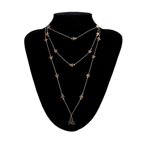 A set of layered gold star-themed necklaces shown from a different angle.