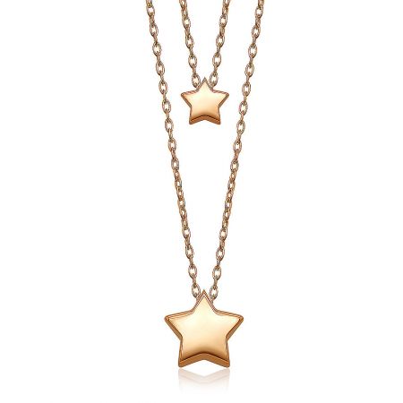 A model wearing the Twin Star Necklace, demonstrating its layering potential and elegant look.