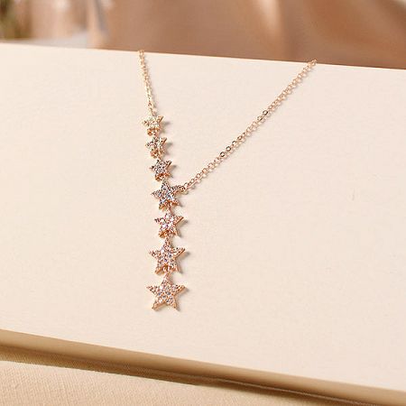 The elegant gold-finished star pendant necklace, a timeless piece of jewelry.