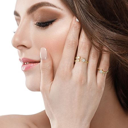 A model wearing the elegant gold star-shaped adjustable ring to showcase its style and fit.