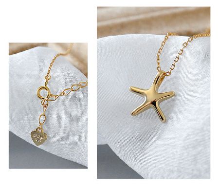 The gold starfish necklace featuring a heart-shaped charm stamped with 'SILVER 925'.