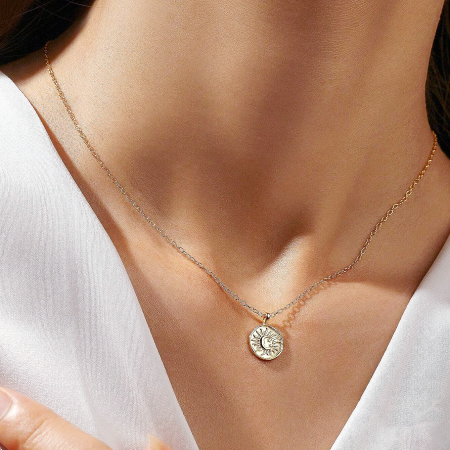 High-quality studio shot of the 925 sterling silver necklace with a sun and moon gold pendant.