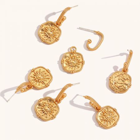 Full set of five pairs of vintage gold sunburst earrings.