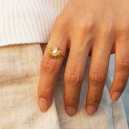 Stainless steel sunburst ring with a white oval stone