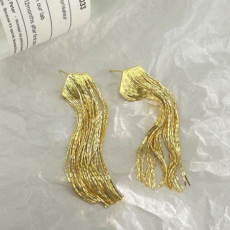 A pair of gold long chain tassel earrings with a unique wavy design, displayed on a white background.