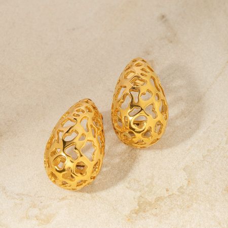 A pair of gold teardrop earrings with a detailed honeycomb lattice pattern.