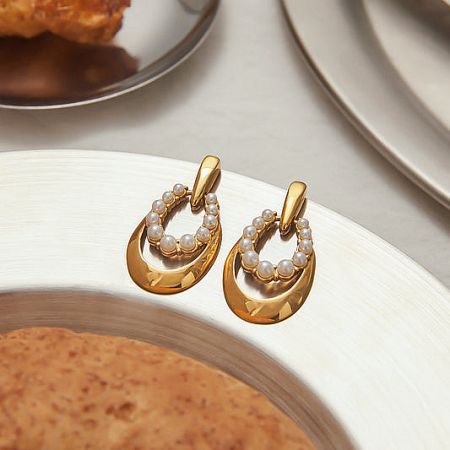 Classic PVD gold plated stainless steel earrings with teardrop pearl accents.