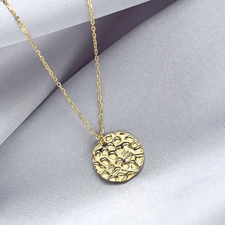 Detailed view of the hammered texture on the gold-plated coin disc pendant necklace.