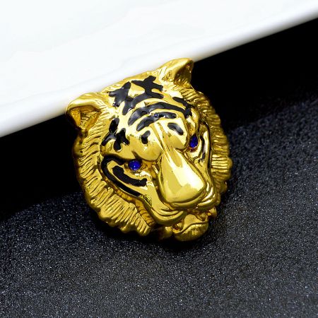 Painted Oil Tiger Head Brooch | Fashion Animal Pin - A detailed close-up of the gold Painted Oil Tiger Head Brooch, showcasing its intricate metalwork, black enamel stripes, and striking blue rhinestone eyes.
