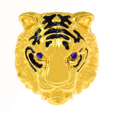 Side profile of the gold tiger head brooch, showing its three-dimensional sculpting.