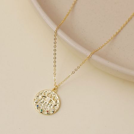 Another view of the gold-tone evil eye necklace showcasing the multicolor gemstone details.