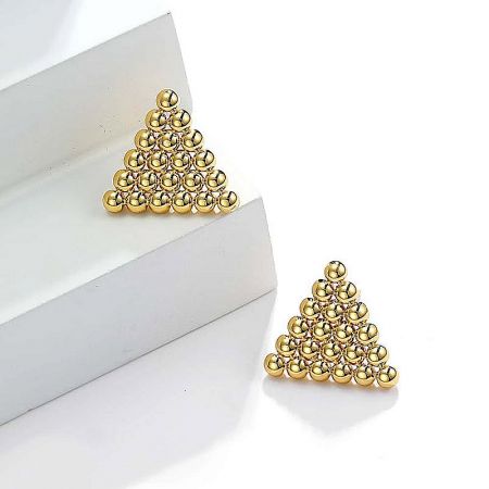 A pair of gold triangular stud earrings made from small gold beads, displayed on a white background.