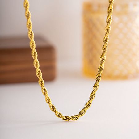 Gold PVD Plated Stainless Steel 5mm Twisted Rope Chain Necklace (Set of 5) - A detailed close-up of the Gold PVD Plated Stainless Steel 5mm Twisted Rope Chain Necklace, showcasing its intricate design and lustrous gold finish.